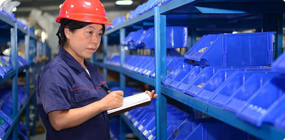 LIANXIN employee checking parts inventory